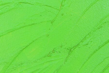 Vibrant green grungy wall texture.