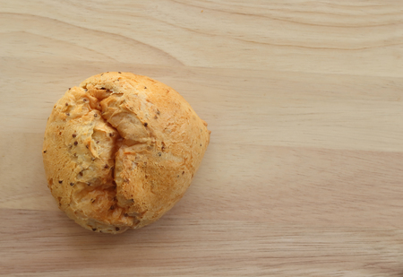 Freshly baked bread isolated on wood background, top view
