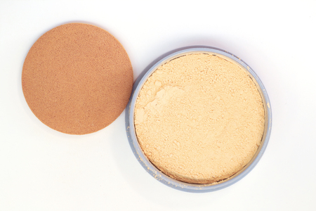 Cream beige powder and puff on white backgroundの写真素材