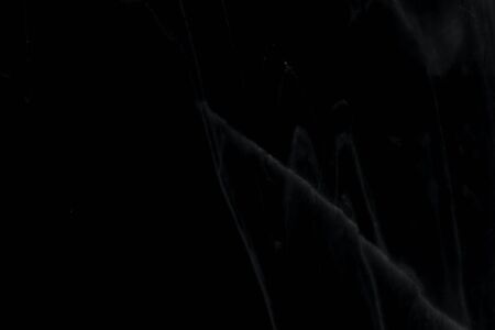 Beautiful patterned black marble background with scratches, used for design.