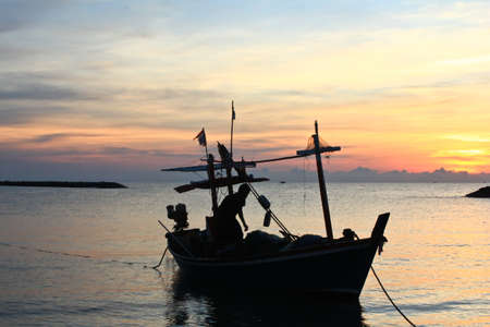 One Fishing Boat Silhouette in sea