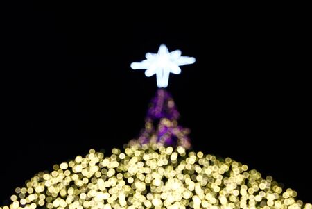 Christmas lights of a Christmas tree with bokeh effectの写真素材