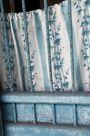 Vintage blue window with draperyの写真素材