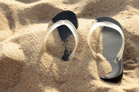 Flip flop on sand beachの写真素材
