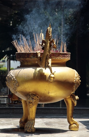 Brass incense burner with smokeの写真素材