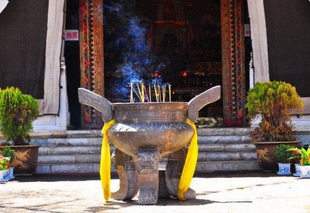 A big incense burner with smoke in Chinese temple の写真素材