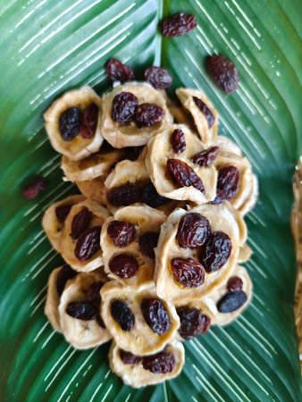 Raisin cookies with raisins on a banana leaf.の写真素材