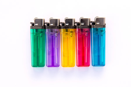 Colored lighters on white backgroundの写真素材