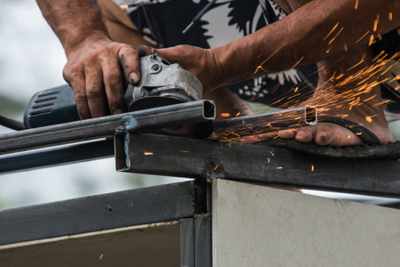 Worker working of a grinding machine