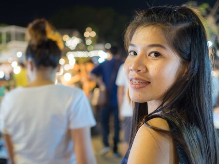 woman with shopping in night marketの写真素材