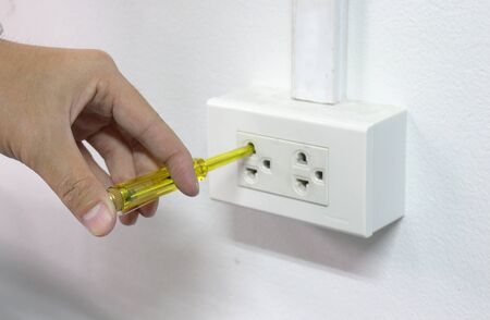 Use hands to catch Screwdrivers Mains Tester for Electrical measurementの写真素材