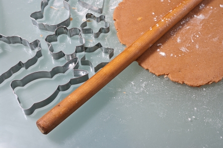 Baking gingerbread cookies, cutters with dough in various formsの写真素材