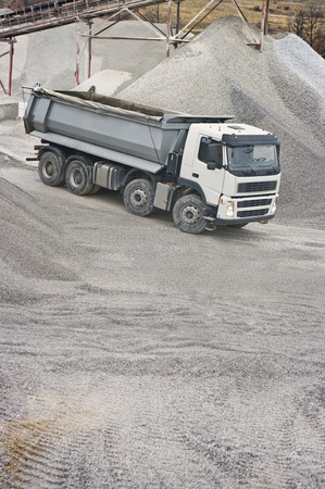 Heavy Truck in Stone Pit. Focus on Truck and copy space at front bottom of imageの写真素材