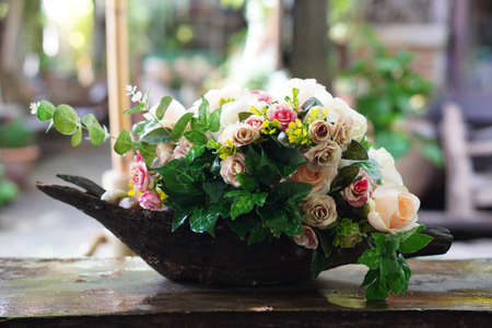 Closeup beautiful flowers bouquet on wooden tableの写真素材