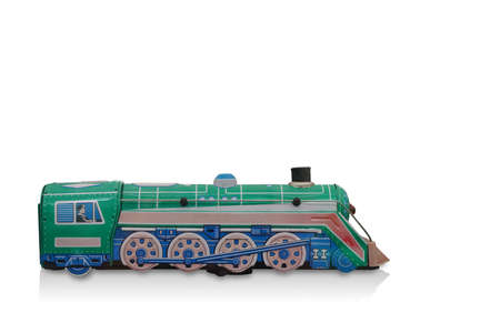 side view ancient green and blue zinc train toy on white background, object, vintage, retro, modern,...