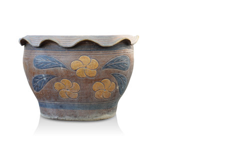 old large brown and yellow and black ceramic pot on blue background, object, decor, vintage, ancient, copy spaceの写真素材