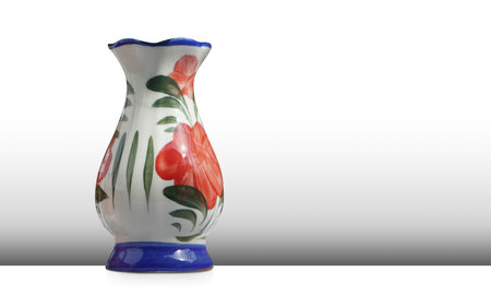 white and blue and red ceramic vase on grey wall and white floor background, object, vintage, modern, copy spaceの写真素材