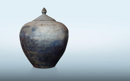 antique and old blue and black clay pot and lid on blue background, vintage, object, decor, copy spaceの写真素材