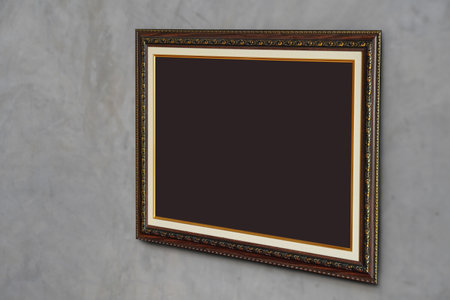 brown paper on brown and gold rectangle frame on cement wall background, object, decor, fashion,...