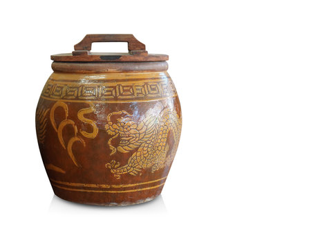 front view old small wooden lid on brown and yellow pot on white background, object, vintage, retro, decor, copy spaceの写真素材