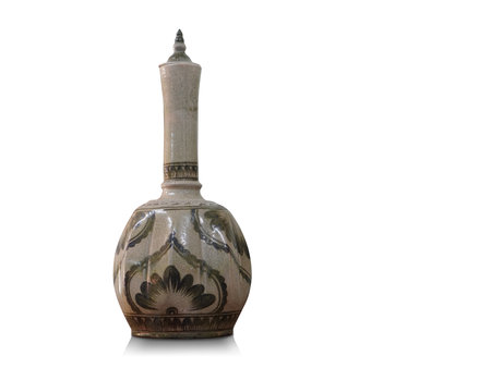 old cream and black ceramic jar and ceramic lid on white background, object, copy spaceの写真素材
