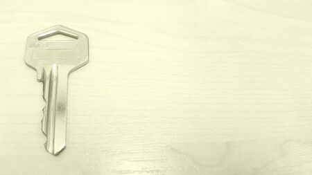 Key on a wooden backgroundの素材