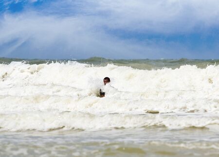 Sea attack people who are swimming in the sea の写真素材