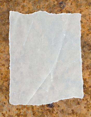 Paper on the old metal board  の写真素材