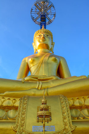 Gold Buddha on top of hill at Buriram Thailandの写真素材