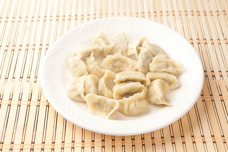 Boiled Dumplings on plateの写真素材
