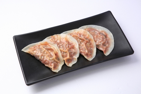 kimchi Flat Dumplings on plateの写真素材
