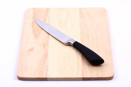 Knife on cutting board isolatedの写真素材