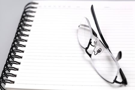 Glasses on the book. Macro shotingの写真素材