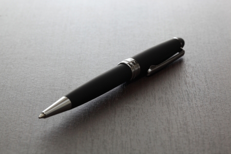 pen on the wooden backgroundの写真素材