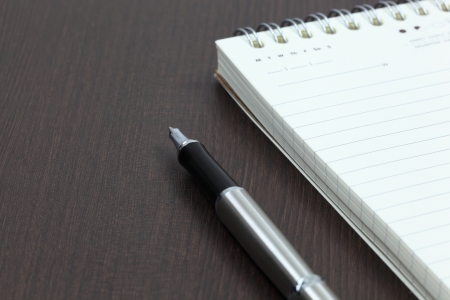 Blank note paper with penの写真素材