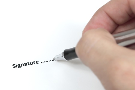 Business man signing a contract.の写真素材