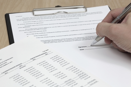Business man signing a contract の写真素材