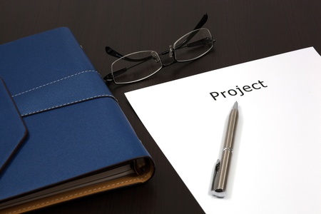 Organizer on table with word project close up in paperの写真素材