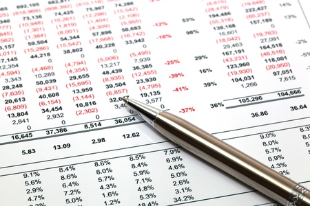 Reading finance report with penの写真素材