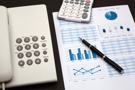 business report with telephone on a tableの写真素材