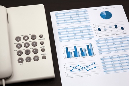 business report with telephone on a tableの写真素材
