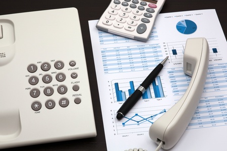 business report with telephone on a tableの写真素材