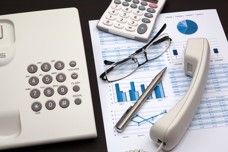 business report with telephone on a tableの写真素材