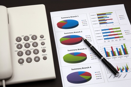 business report with telephone on a tableの写真素材