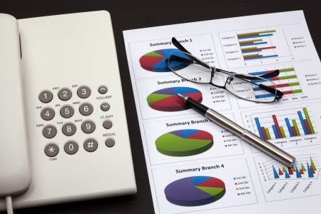 business report with telephone on a tableの写真素材