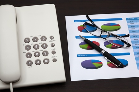 business report with telephone on a tableの写真素材
