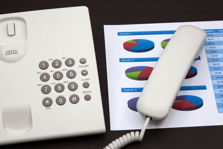 business report with telephone on a tableの写真素材