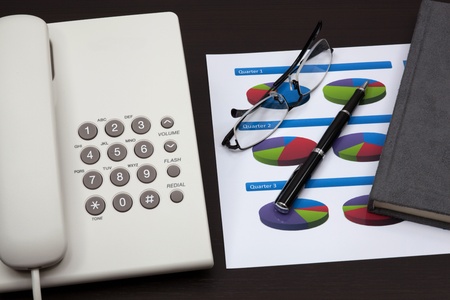 business report with telephone on a tableの写真素材