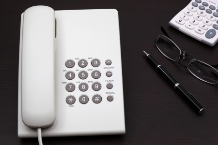 telephone white on a tableの写真素材