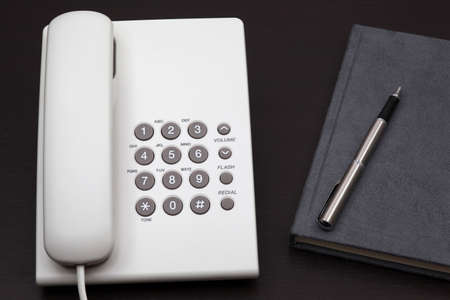 telephone white on a tableの写真素材